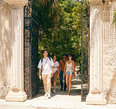 People walking through a gate. Links to Gifts of Life Insurance